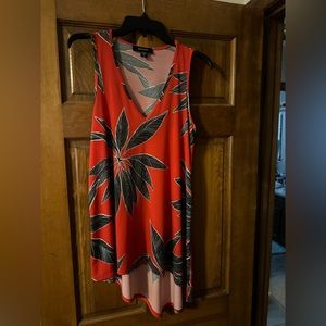 Karen Kane top Medium Tropical Black and Orange longer in the back